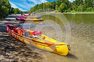 Kayaking on the river in the summer. Kayak with puddles at foreground