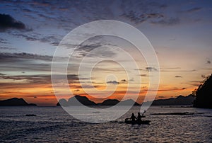 Kayaking at sunset in the calm sea in tropical Philippines