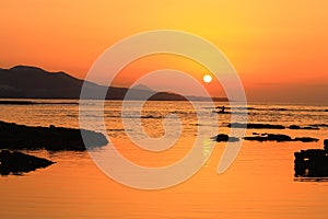 Kayaking in the sunset of Las Canteras beach photo