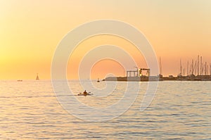 Kayaking during sunset in the port of Umag.