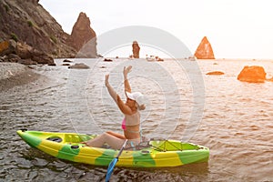 Woman kayak sea. Happy tourist enjoy taking picture outdoors for memories. Woman traveler posing in kayak canoe at sea