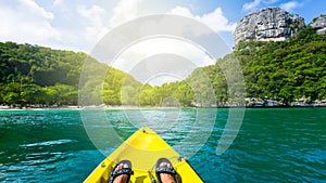 Kayaking at the tropical island on sunny summer