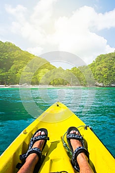 Kayaking at the tropical island on sunny summer