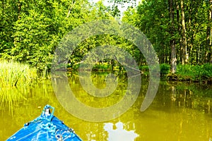 Kayaking by wild river in poland (Omulew river)