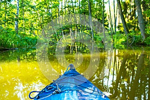 Kayaking by wild river in poland (Omulew river)