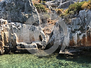 Kayakoy KekovaSimena village,Fethiye,Mugla Sunken city of Kekova in bay of Ucagiz view from sea in Antalya province of Turkey photo