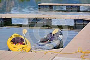 Kayaks At A Dock On A Lake