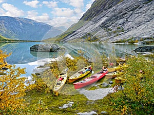 Kayaks at glacier lake, Autumn