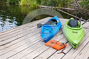 Kayaks and Life Jacket on Fishing Pier