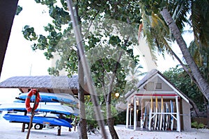 Kayaks and life-saving gear along the beach