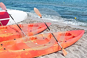 Kayaks on the beach by the sea photo