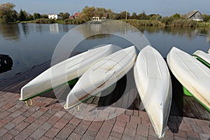 Kayaks on the pier of the country complex \