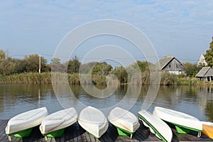 Kayaks on the pier of the country complex \