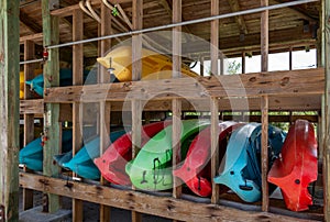 Kayaks for rent on wooden rack at marina - West Lake Park, Hollywood, Florida, USA
