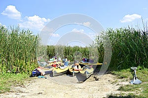 Kayaks on the river bank during the afternoon rest