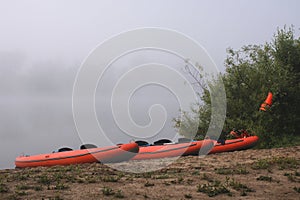 Kayaks on the sand bank of the river