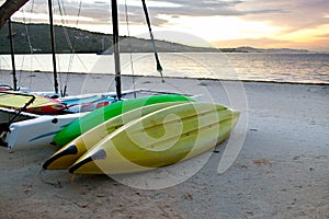 Kayaks on sand on seashore