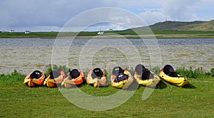 Kayaks on the shore of Scottish loch