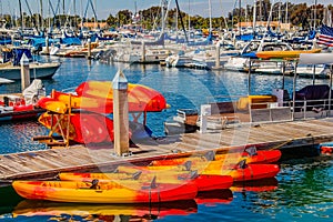Kayaks sit stacked at Mission Bay harbor in San Diego CA