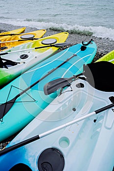 Kayaks and SUP boards on the sea. Extreme sport. Leisure.