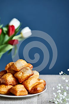 Kazakh baursaks and tulips on Nauryz festival