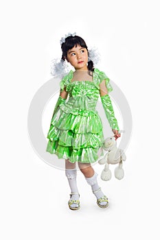 Kazakh girl of 5-6 years in a green dress.