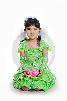 Kazakh girl of 5-6 years in a green dress.