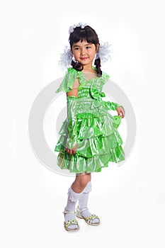 Kazakh girl of 5-6 years in a green dress, full length.