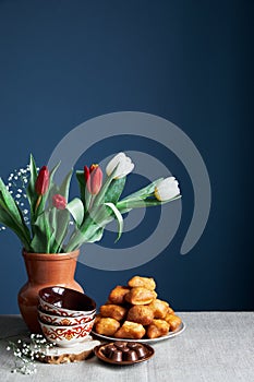 Kazakh national dish, bread baursaks and tulips on Nauryz festival