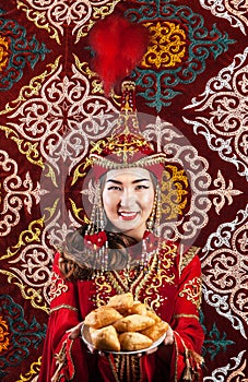 Kazakh woman with national food on Nauryz festival