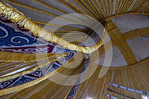 Kazakh yurt interior with round hole in the dome photo