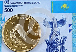 A Kazakhstan 500 tenge bank note with a gold Krugerrand coin