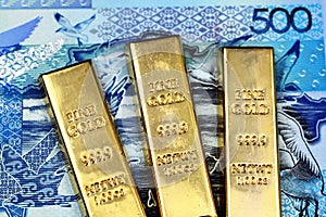A Kazakhstan 500 tenge bank note with three small gold bars