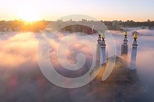 The Kazan Mosque is shrouded in mist at dawn