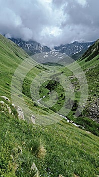 Kazbegi region, Georgia, picturesque mountain landscape wiht Chauhi River and Caucasus mountain range, Juta valley