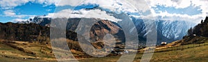 Kazbegi Stepantsminda and Gergeti against Caucasus mountains. Georgia.