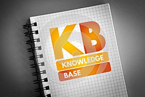 KB - Knowledge Base acronym on notepad, technology concept background photo