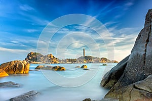 Ke Ga Lighthouse sunset with surf patted smoother reefs create clouds on the sea