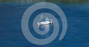 Kea, Tzia, Greece. Traditional fishing boat, trawler moored at Otzias cove