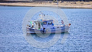 Kea, Tzia, Greece. Traditional fishing boat, trawler moored at Otzias cove