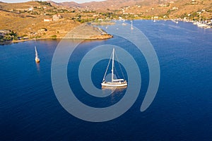 Kea Tzia island, Cyclades, Greece. Aerial drone photo of the bay at sunset time