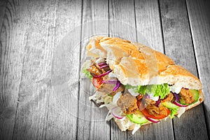 Kebab Sandwich on Wooden Table with Copy Space