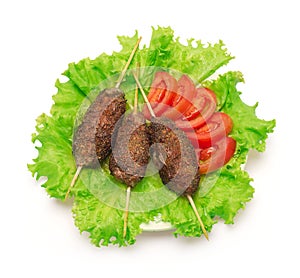 Kebab, tomato and green salad on white background.