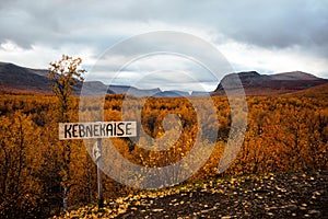 Kebnekaise road sign with an autumn forest in the background, Nikkaluokta, Schweden