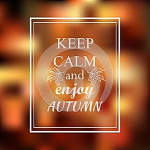 Keep calm and enjoy autumn phrase on orange blur