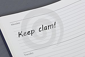 Keep calm reminder message in an open diary