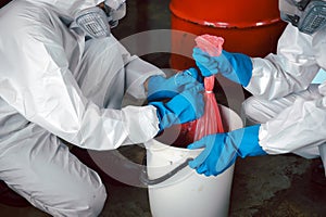 Keep Chemicals in Toxic Waste Red Bag and Thick Plastic Barrels for Disposal, Dispose of Material Safely. Clean up Chemical Liquid