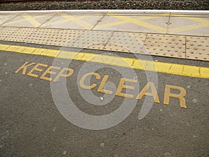 Keep clear markings at on a railway platform in the UK