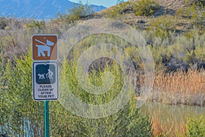 Keep Dogs on leash, please clean up after your pets sign. At Topock Marsh, Lake Havasu, Arizona USA