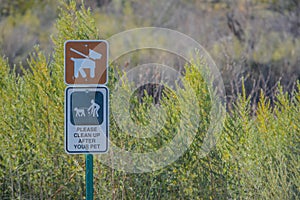 Keep Dogs on leash, please clean up after your pets sign. At Topock Marsh, Lake Havasu, Arizona USA